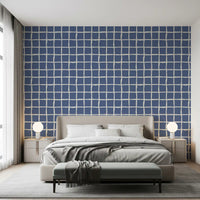 Patterned with dusty blue checks and cream gaps, a Bedroom gains this wallpaper.