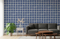 Between blue squares and cream gaps, a Living room rests with the Wavy Grid wallpaper
