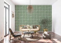 Loose drawn feel reads across cream lines framing each sage check on the wallpaper.