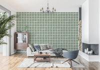 Cream wavy lines stretch through a hallway on the Mid Sage wallpaper layout.