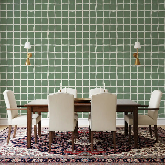 Sketched sage squares meet a dining room behind Wavy Grid Sage wallpaper detail.