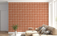 Wobbly cream channels deep terracotta on a Mid Century Wavy Grid wallpaper.