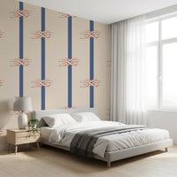 Knot motifs flow between vertical bands on a Beige Navy wallpaper in a Bedroom 