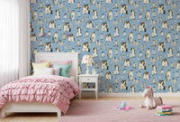 In a Kids bedroom layout, watercolour penguins waddle across this Penguin Family wallpaper.