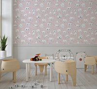 Cub-and-mother scenes warm a Kids play area, painted onto pink watercolour bear wallpaper.