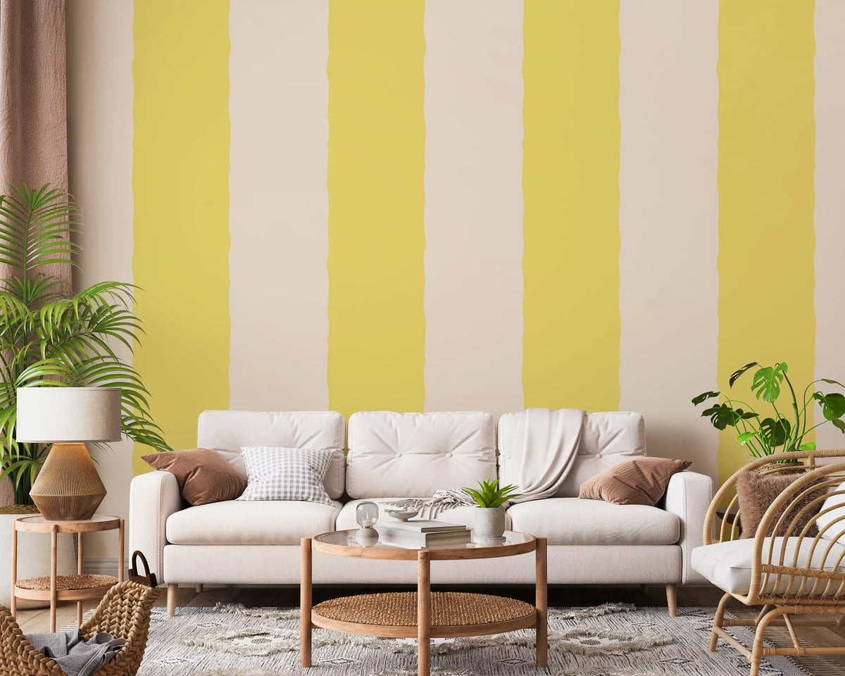 Wide cream and butter yellow bands line a relaxed living room with stripe wallpaper.