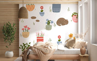 Behangmuur met slapende katten en potplanten