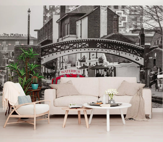 Red canal cruiser popping through a monochrome wall mural in a living room GD11139