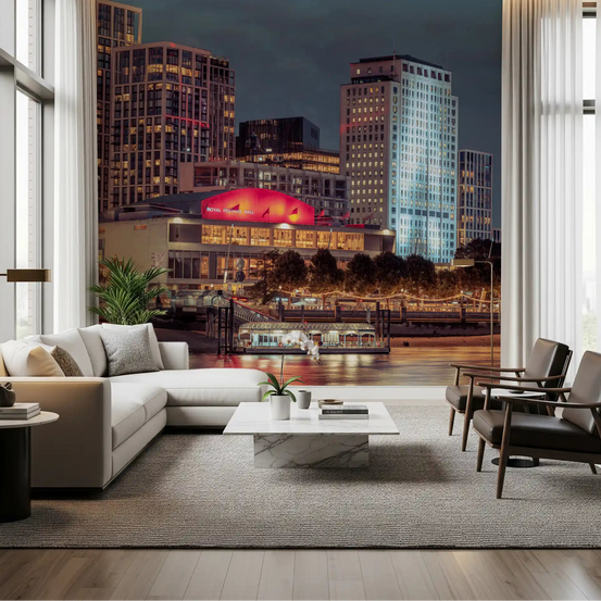 Twilight London riverfront glows on a wall mural across a living room GD11206