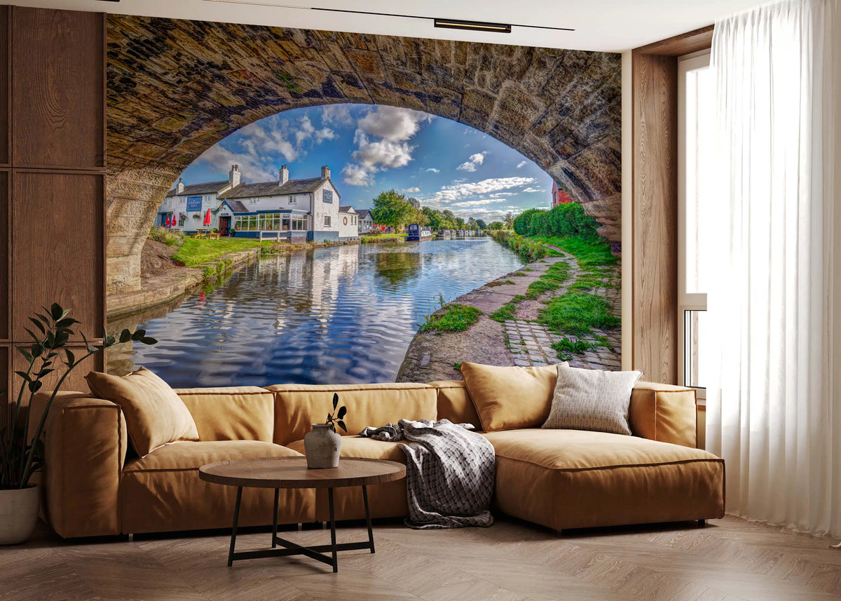 Blue canal view through a stone archway wall mural in a living room GD11463