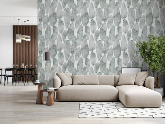 Carta da parati con texture effetto ciottoli verde salvia tenue