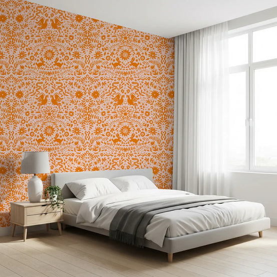 Mexican folk art wallpaper behind a wood bed with grey and white bedding by a window GD12265