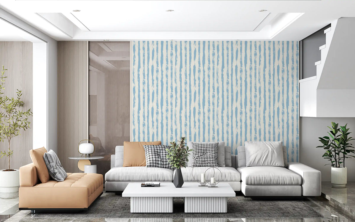 Azure brushstroke stripes wallpaper in an open plan living room with a tan and grey sectional GD12270