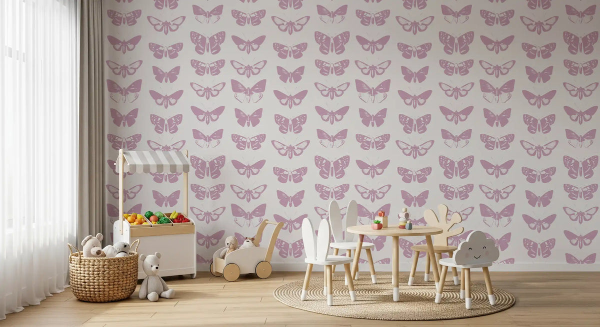 Pink butterfly wallpaper in a kids play area with a bunny table and toy basket GD12294