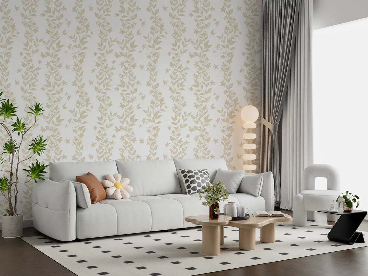 Cream botanical vine wallpaper in a living room with a white sofa and potted plants GD12307