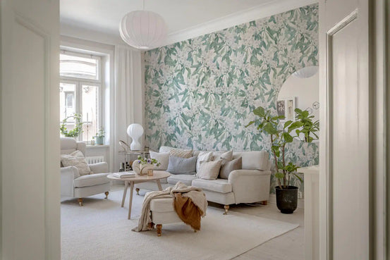 Garden leaves trail behind a calm living room in the Leaf Trail wallpaper GD12360