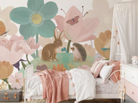 Garden blooms nursery mural behind a white iron crib with a pink canopy GD12394