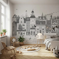 Feline street scene wall mural in a kids room with a rattan chair and plants GD12395