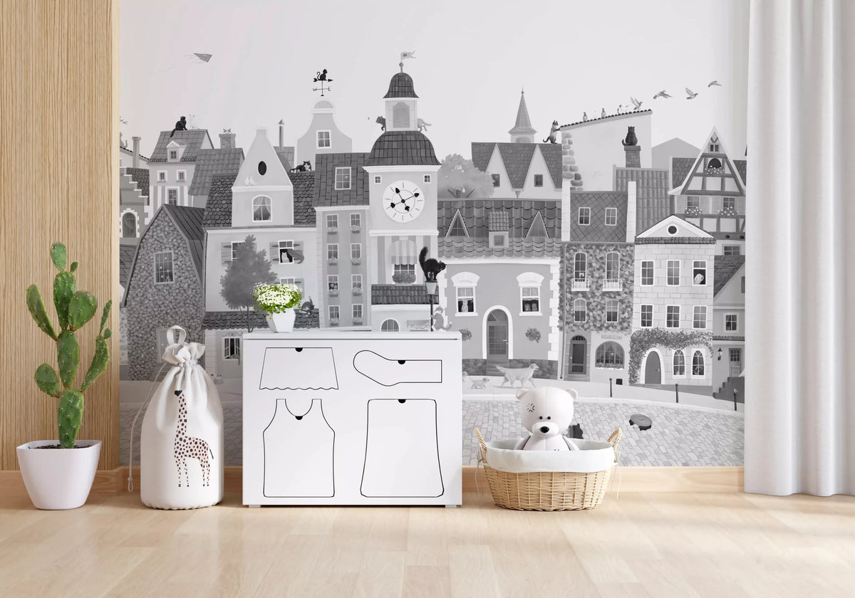 Grey town mural in a playroom with a white play kitchen and a giraffe toy GD12395