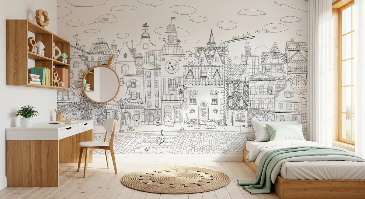 Cityscape wall mural in a child's room with white desk, round mirror and mint bed throw GD12396