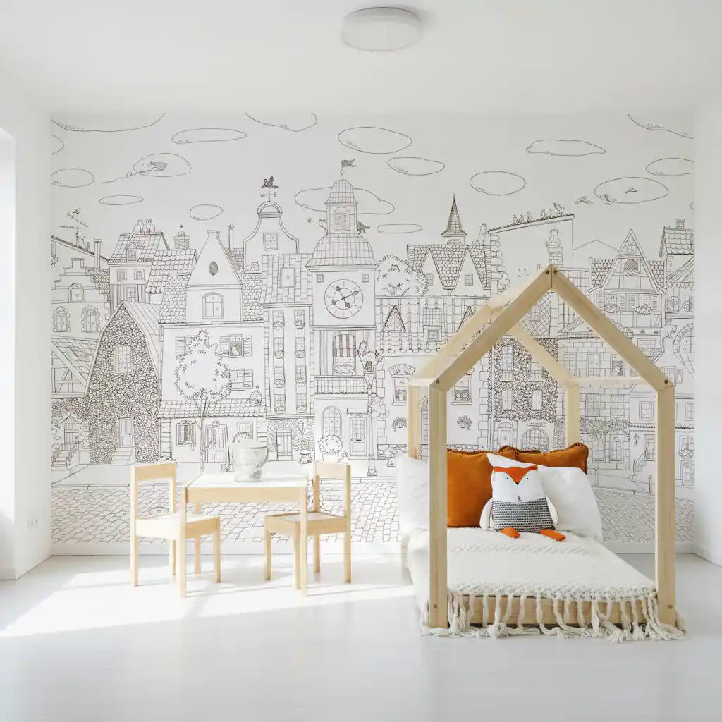 Cat village wall mural framing a house-frame bed with an orange fox cushion and play table GD12397