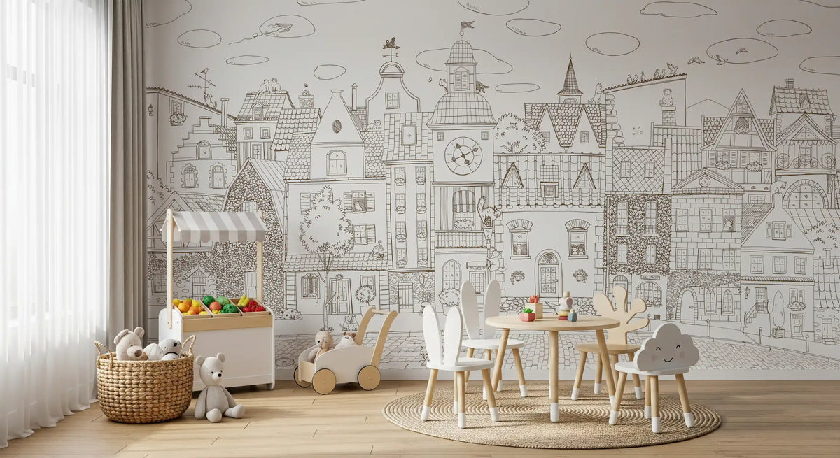 Monochrome village mural behind a play table with white chairs and a toy storage cabinet GD12397