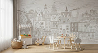 Monochrome village mural behind a play table with white chairs and a toy storage cabinet GD12397