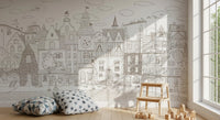 Monochrome village mural in a corner styled with star-print cushions and a wooden stool GD12397