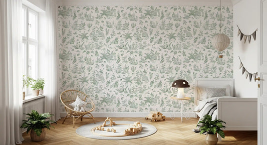 Forest friends wallpaper in a nursery with rattan chair and toys on a round rug GD12430