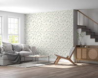 Papel de parede com padrão repetido de folhas em creme e verde-sálvia