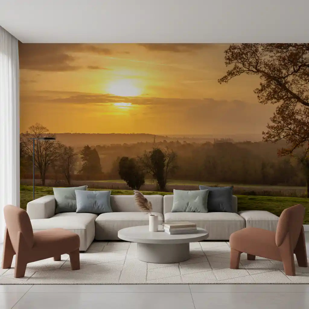 Sunset wall mural glowing over a living room with a white sofa and terracotta chairs GD12840