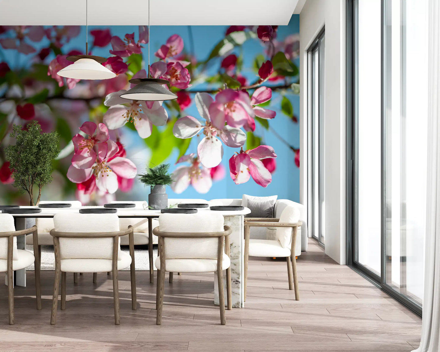 Panorama mural de branches fleuries roses sur fond bleu ciel