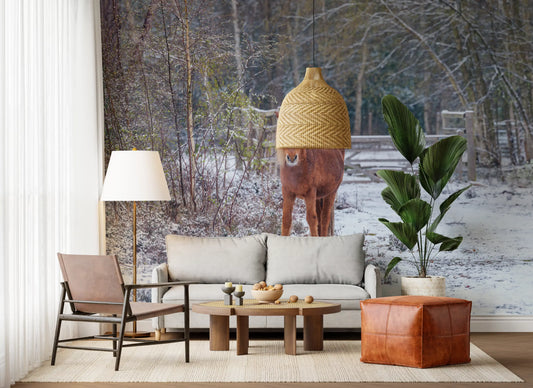 Living room with rattan pendant and a winter woodland pony mural in soft snowy tones GD13054