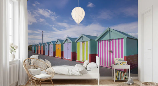 Wandbild „Reihe gestreifter Strandhütten am Meer“