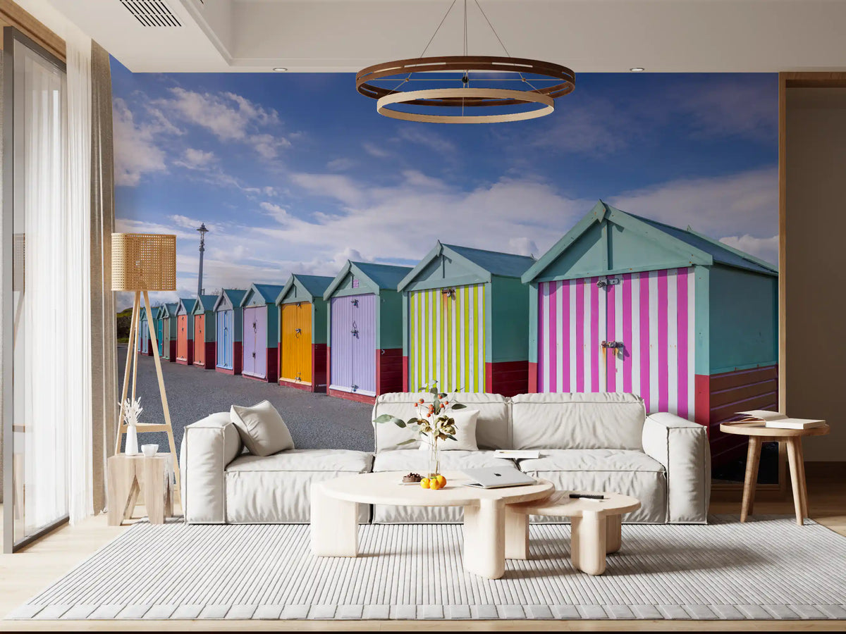 Beach wallpaper in a living room with cream sofas and a ring pendant light GD13132