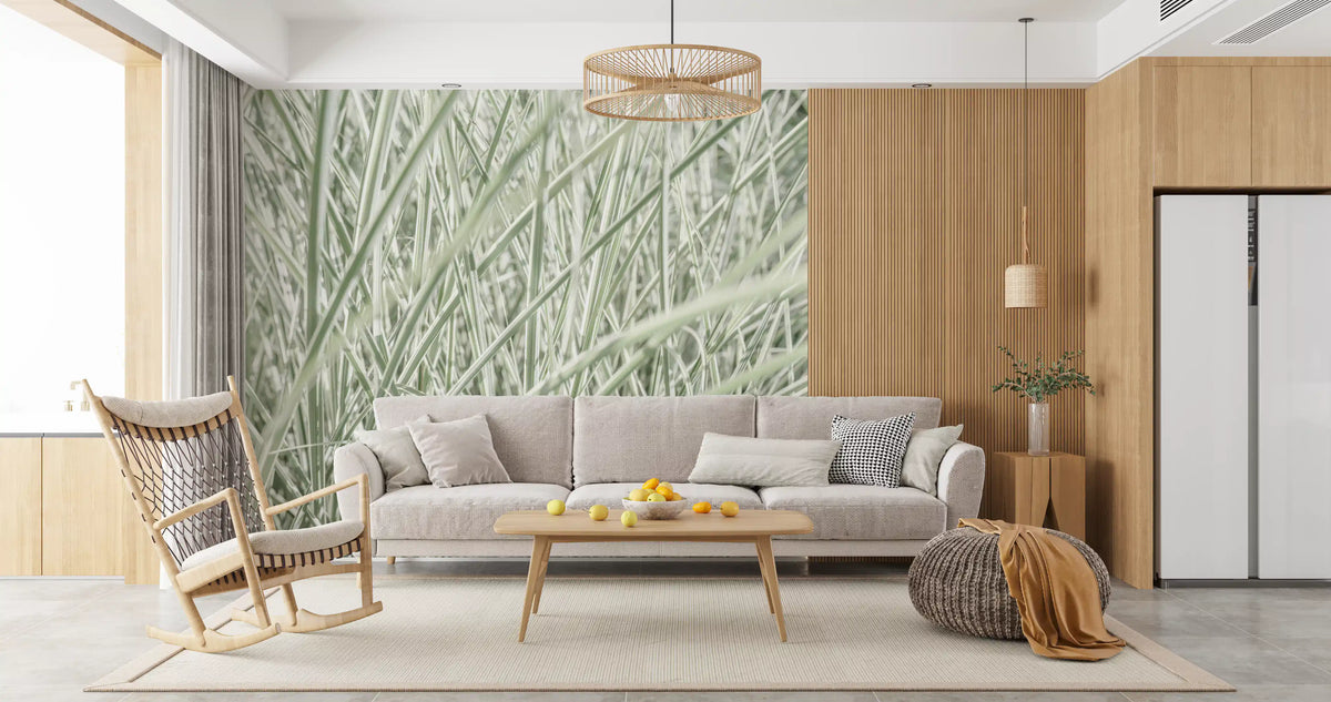 Green grass mural behind a gray sofa with a rattan pendant and rocking chair GD13142