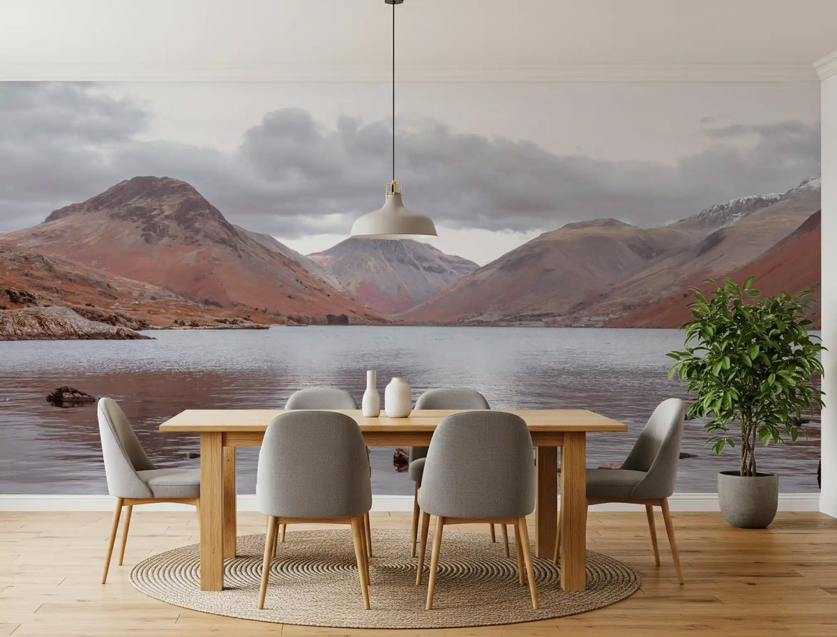 Mountain lake wall mural behind a wood dining table with gray chairs GD13143