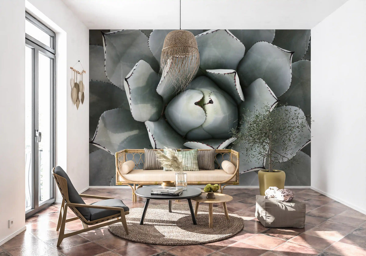 Sage gray succulent mural in a lounge with rattan loveseat and terracotta tile floor GD13148