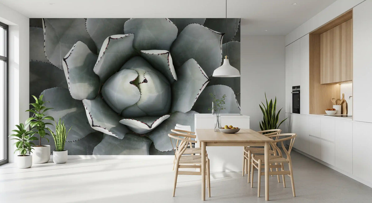 Botanical wallpaper of a gray agave rosette in a white kitchen with light wood dining set GD13148