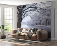 Wandbild mit zugefrorenem Kanal und winterlichem Wald