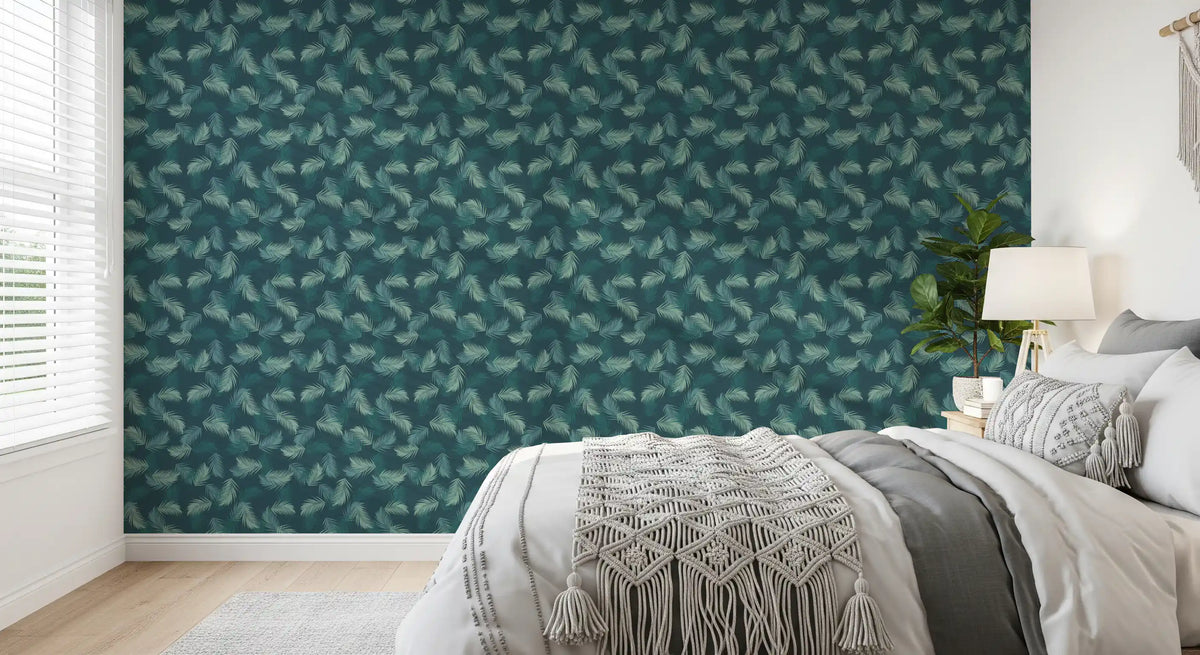 Leaf wallpaper beside a bed with macrame throw, gray blanket and white lamp GD13580