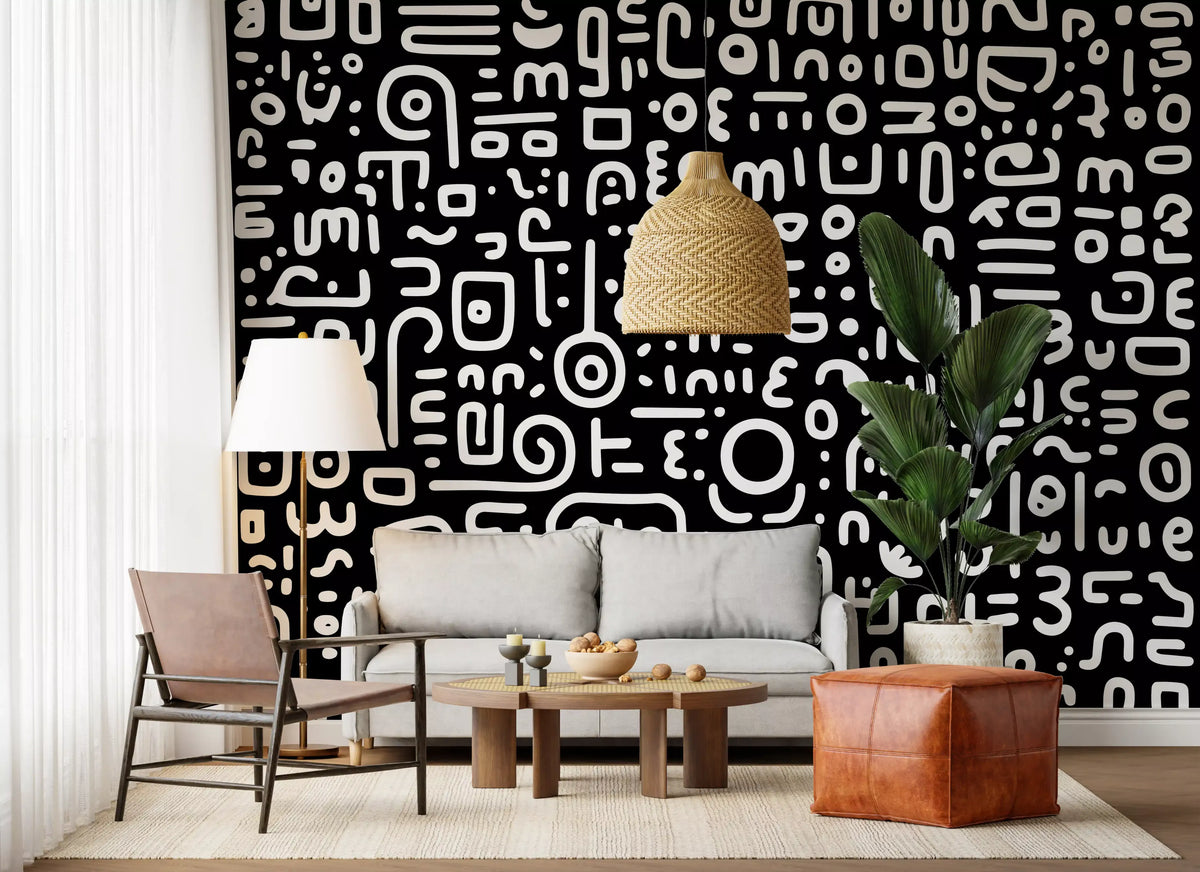 Monochrome geometrische Kritzel-Symbole auf schwarzem Wandbild