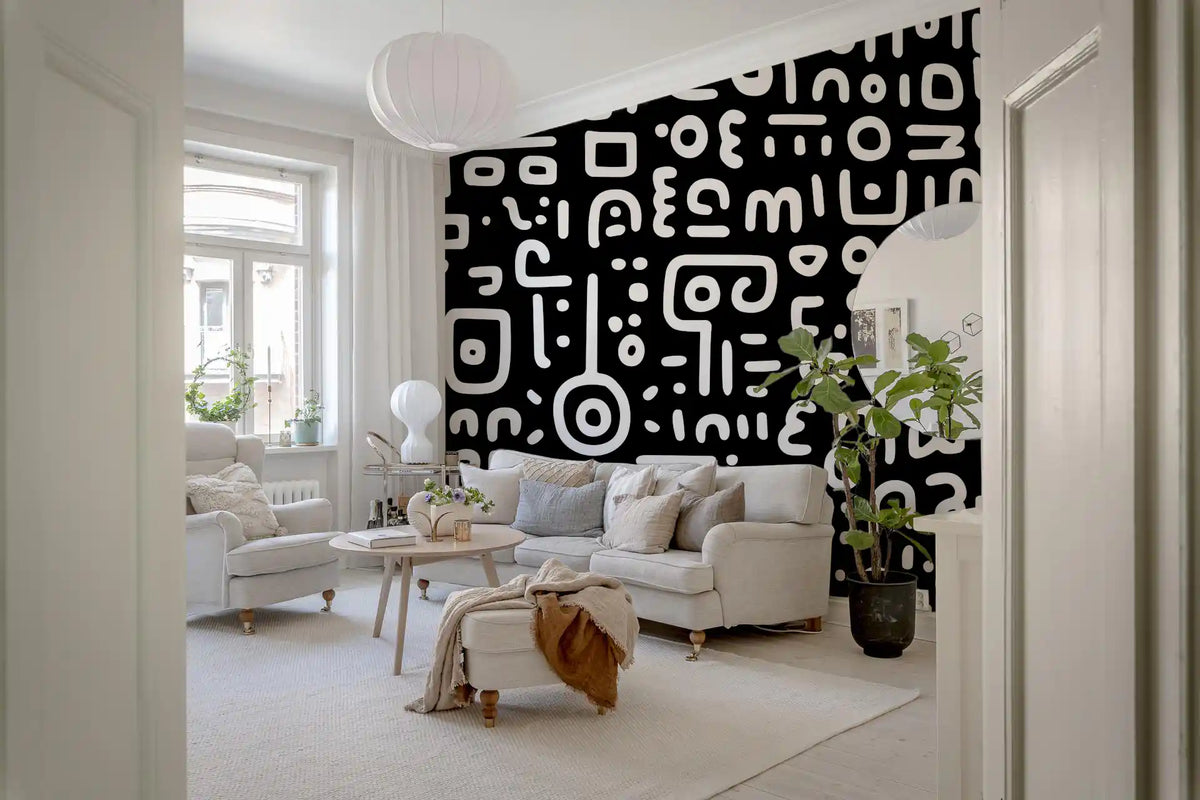 Monochrome geometrische Kritzel-Symbole auf schwarzem Wandbild