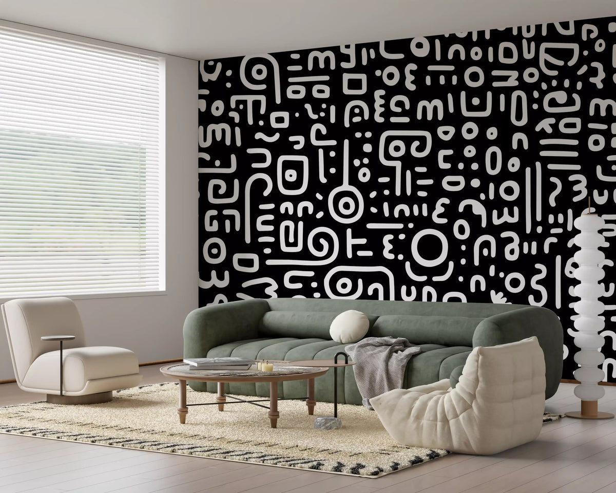 Monochrome geometrische Kritzel-Symbole auf schwarzem Wandbild