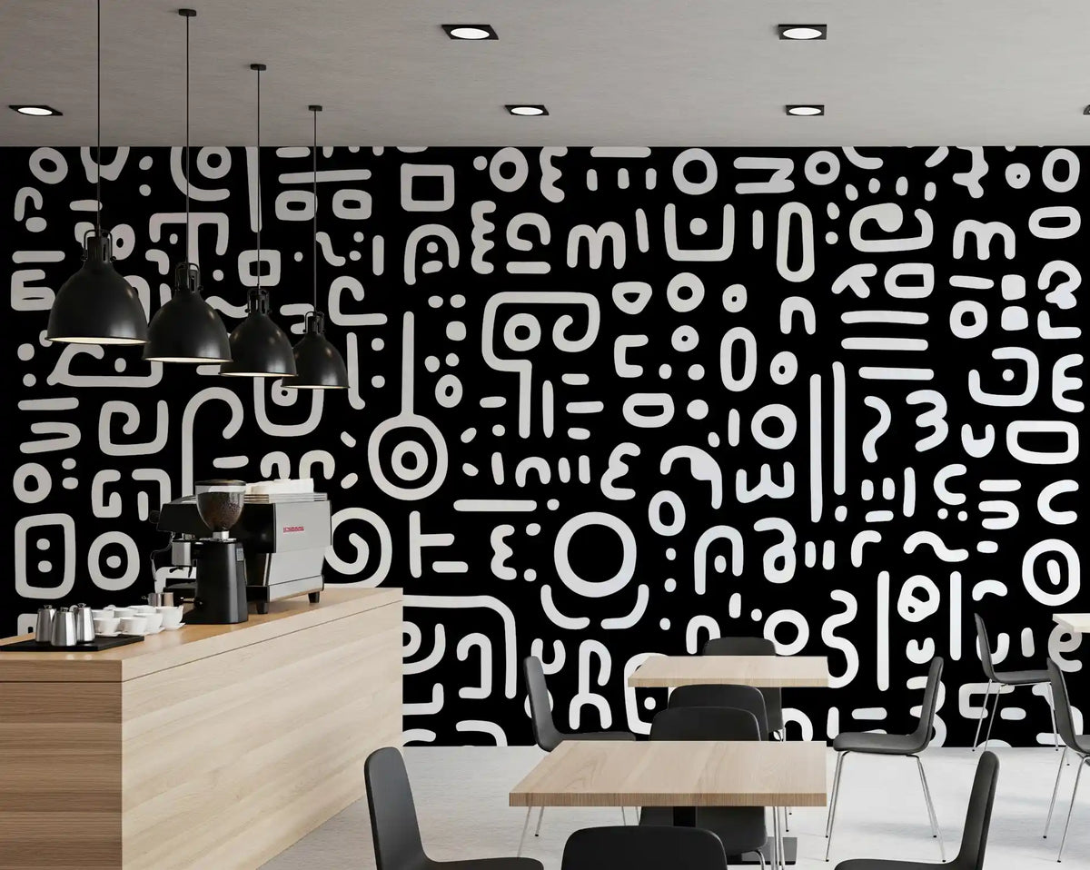 Monochrome geometrische Kritzel-Symbole auf schwarzem Wandbild