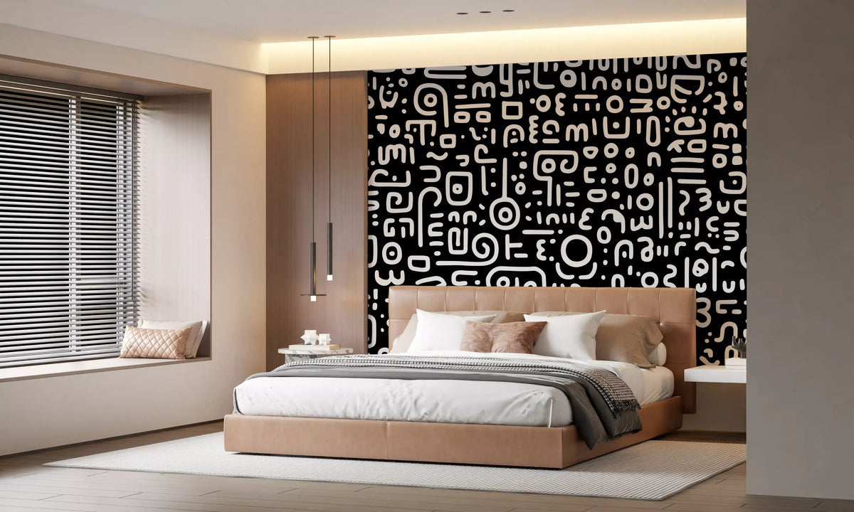 Monochrome geometrische Kritzel-Symbole auf schwarzem Wandbild