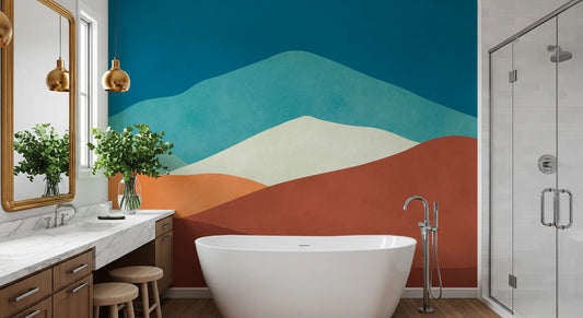 Landscape wallpaper in a bathroom with white freestanding tub, marble vanity and gold mirror GD13774