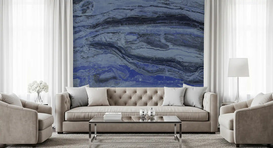 Tufted beige sofa and glass coffee table against a midnight blue marble mural GD13998
