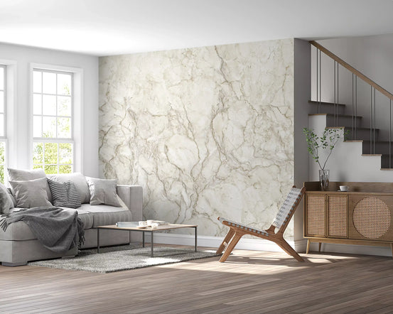 Marble wallpaper in cream behind a gray sofa next to a staircase and rattan sideboard GD14018