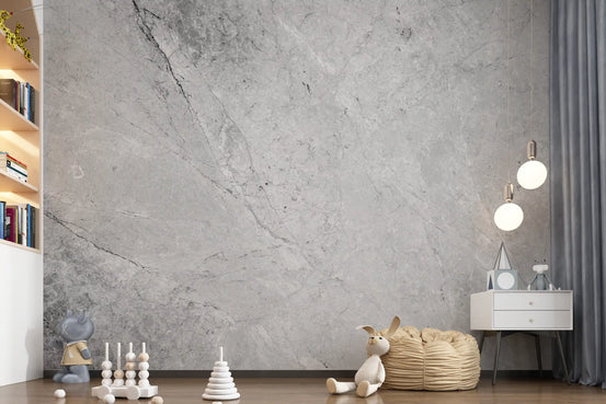 Nursery with wooden toys, plush bunny and white nightstand on gray marble wallpaper GD14030